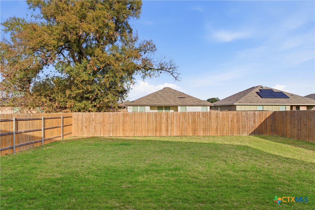 9506 Falme Lane Killeen, TX 76542 - Photo 27 of 27 a view of yard with swimming pool and trees in the background