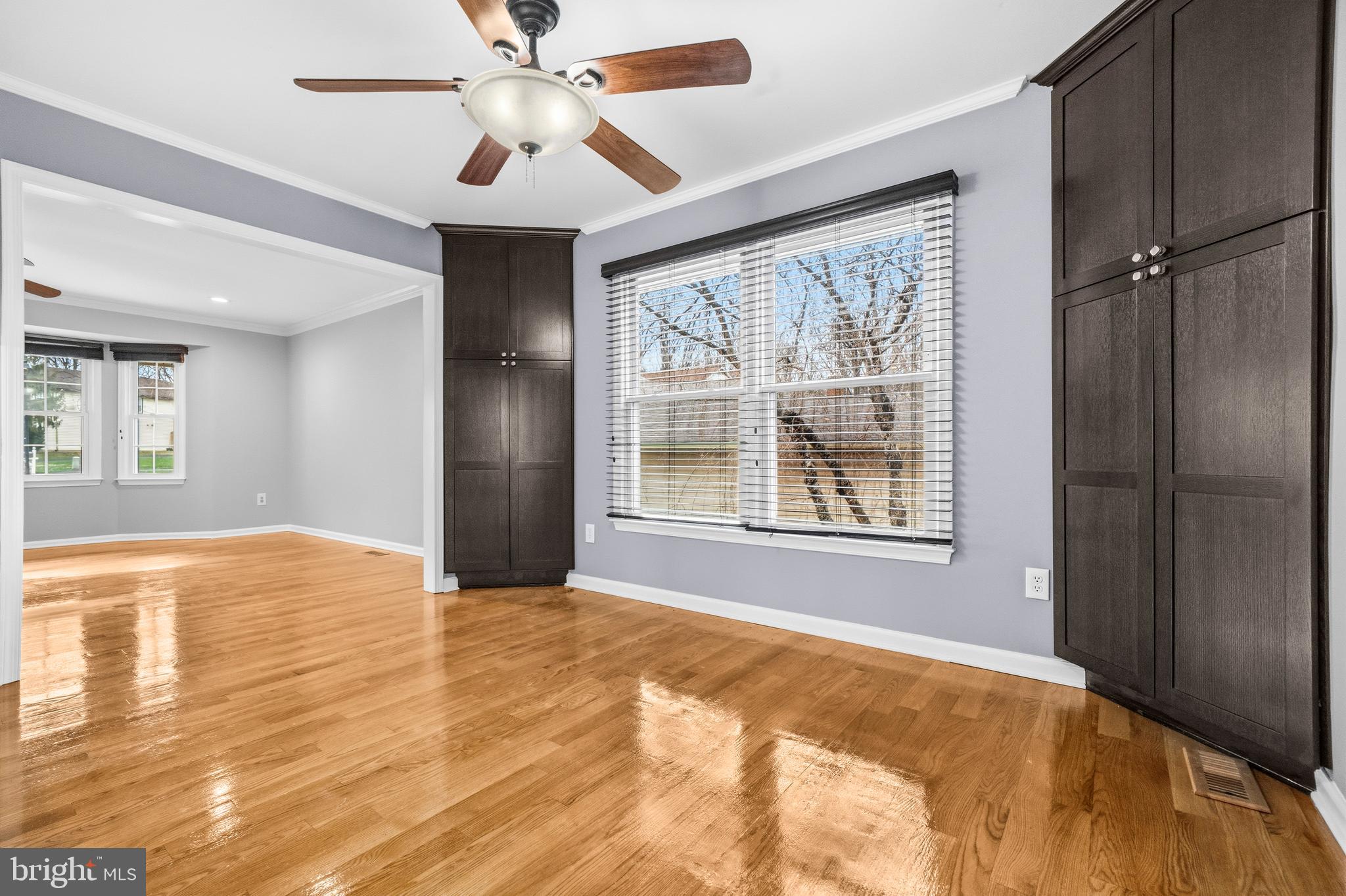 7201 Neaptide Lane Burke, VA 22015 - Photo 11 of 75 a view of an empty room with a window and kitchen view
