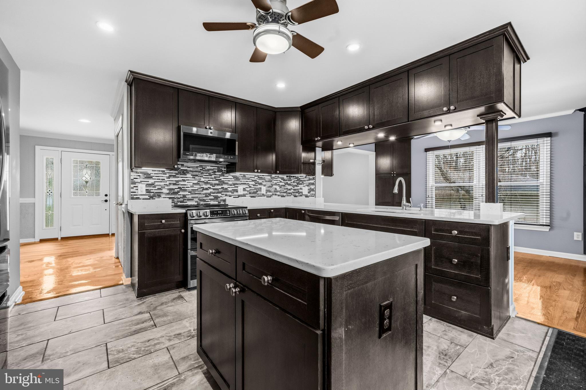 7201 Neaptide Lane Burke, VA 22015 - Photo 18 of 75 a kitchen with a counter space a sink appliances and cabinets