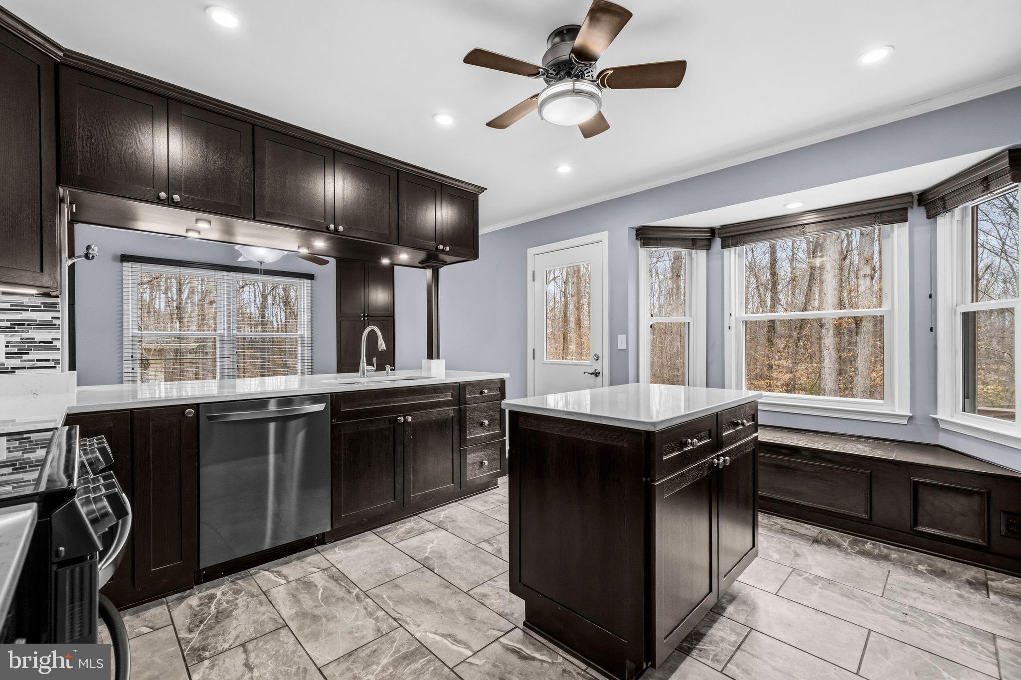 7201 Neaptide Lane Burke, VA 22015 - Photo 19 of 75 a kitchen with granite countertop a sink counter top space appliances and a window