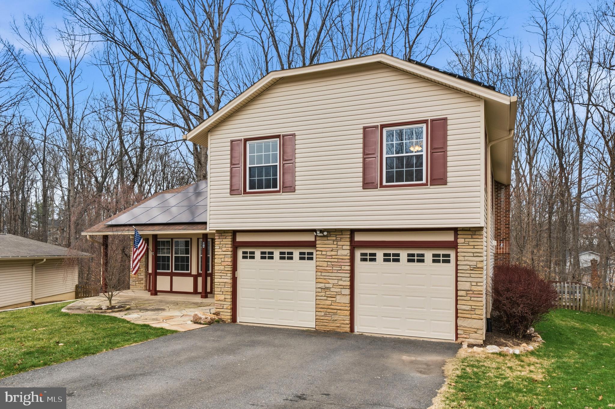 7201 Neaptide Lane Burke, VA 22015 - Photo 2 of 75 a front view of a house with a yard