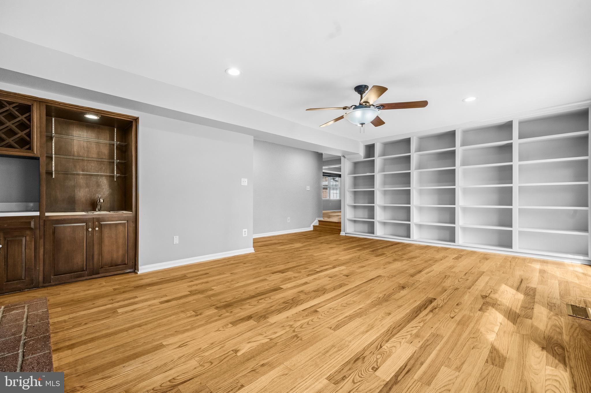 7201 Neaptide Lane Burke, VA 22015 - Photo 23 of 75 a view of an empty room with a window and a ceiling fan