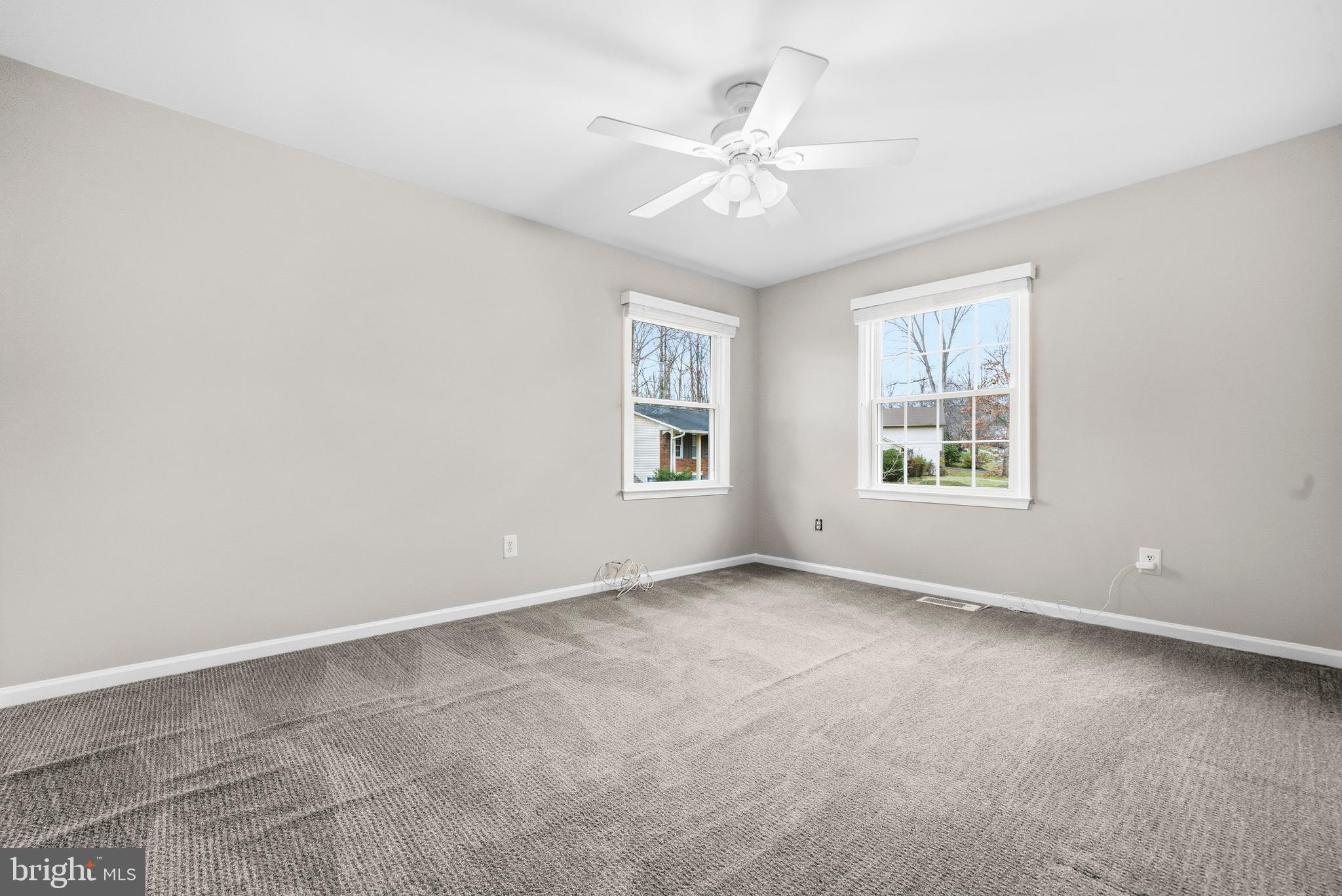 7201 Neaptide Lane Burke, VA 22015 - Photo 28 of 75 an empty room with windows and fan