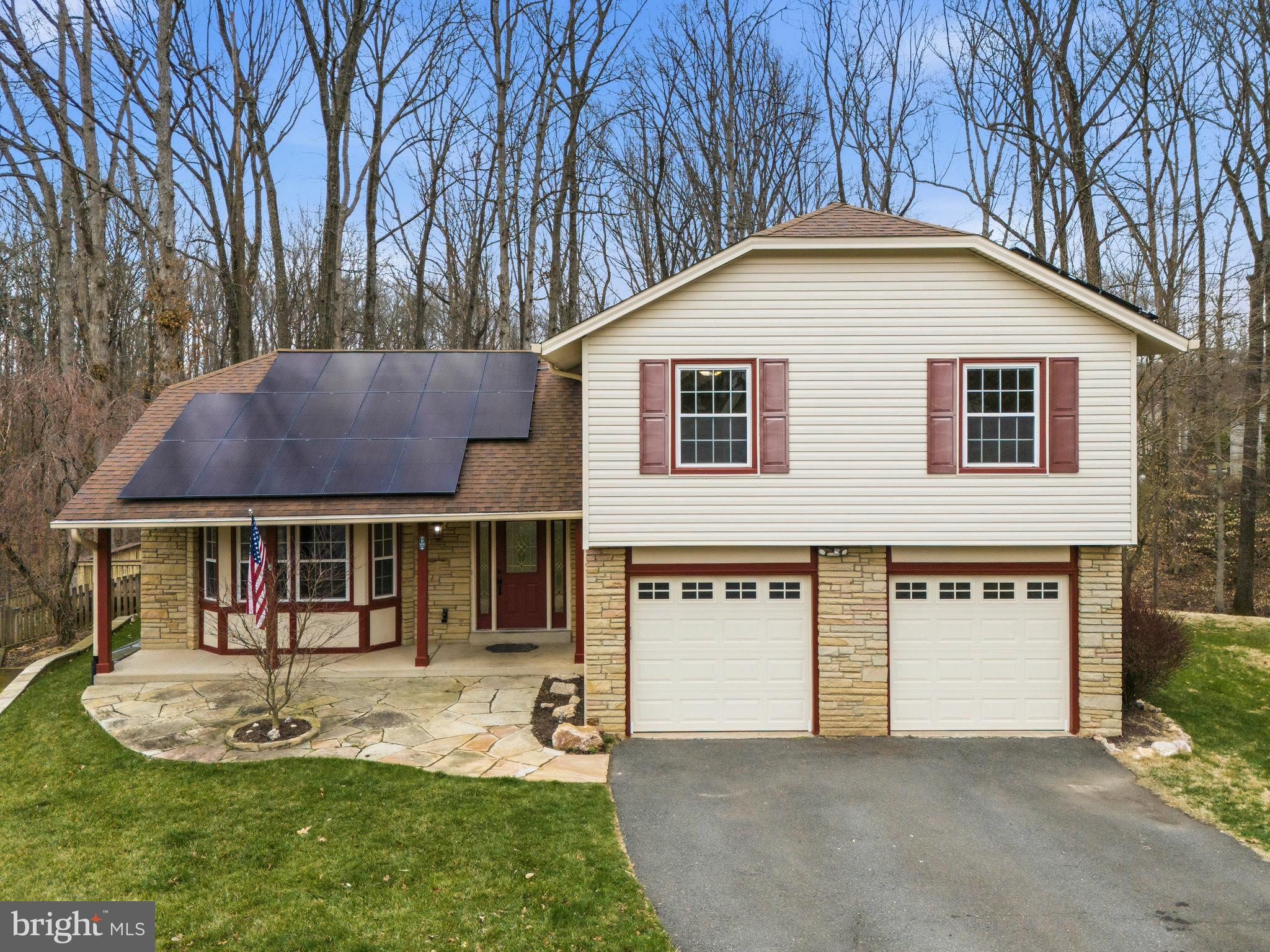 7201 Neaptide Lane Burke, VA 22015 - Photo 3 of 75 a view of a house with a yard patio and fire pit