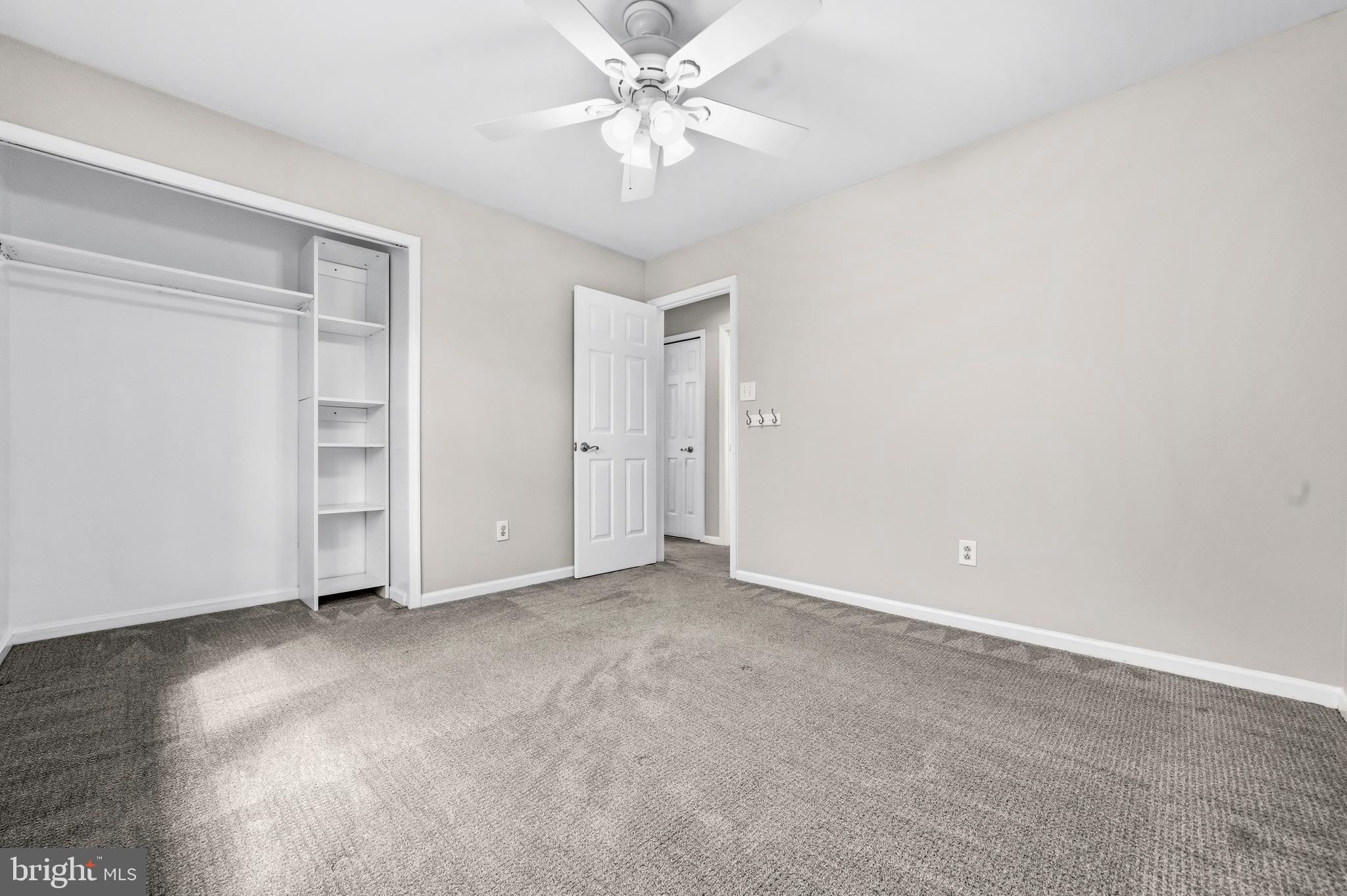 7201 Neaptide Lane Burke, VA 22015 - Photo 33 of 75 an empty room with a ceiling fan and a window