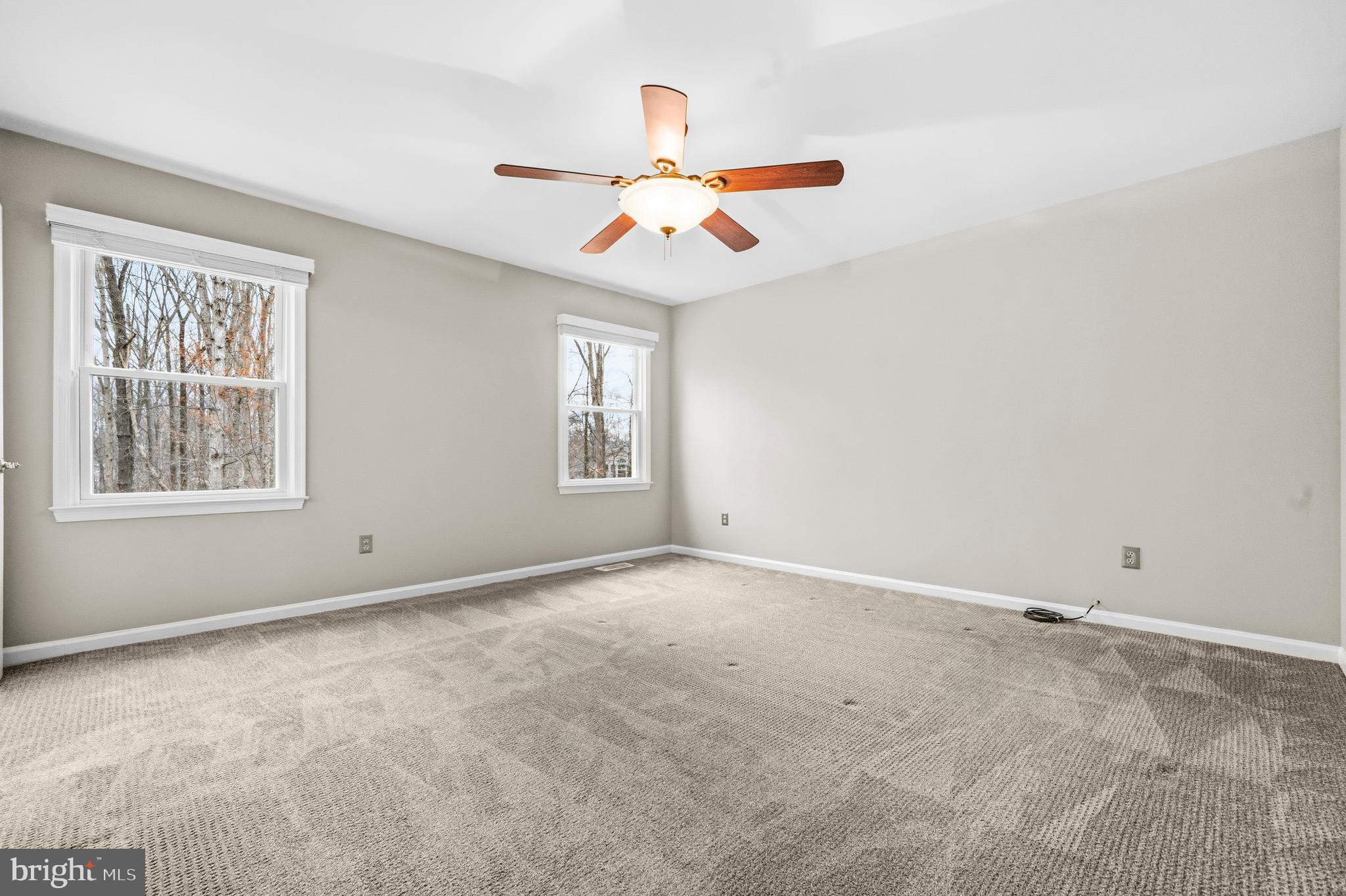 7201 Neaptide Lane Burke, VA 22015 - Photo 34 of 75 an empty room with windows and fan