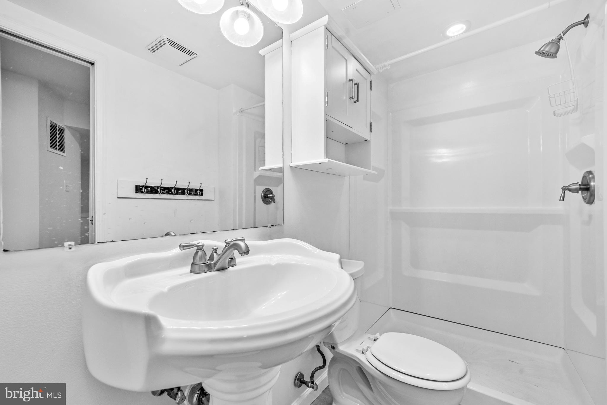7201 Neaptide Lane Burke, VA 22015 - Photo 46 of 75 a bathroom with a sink toilet and shower