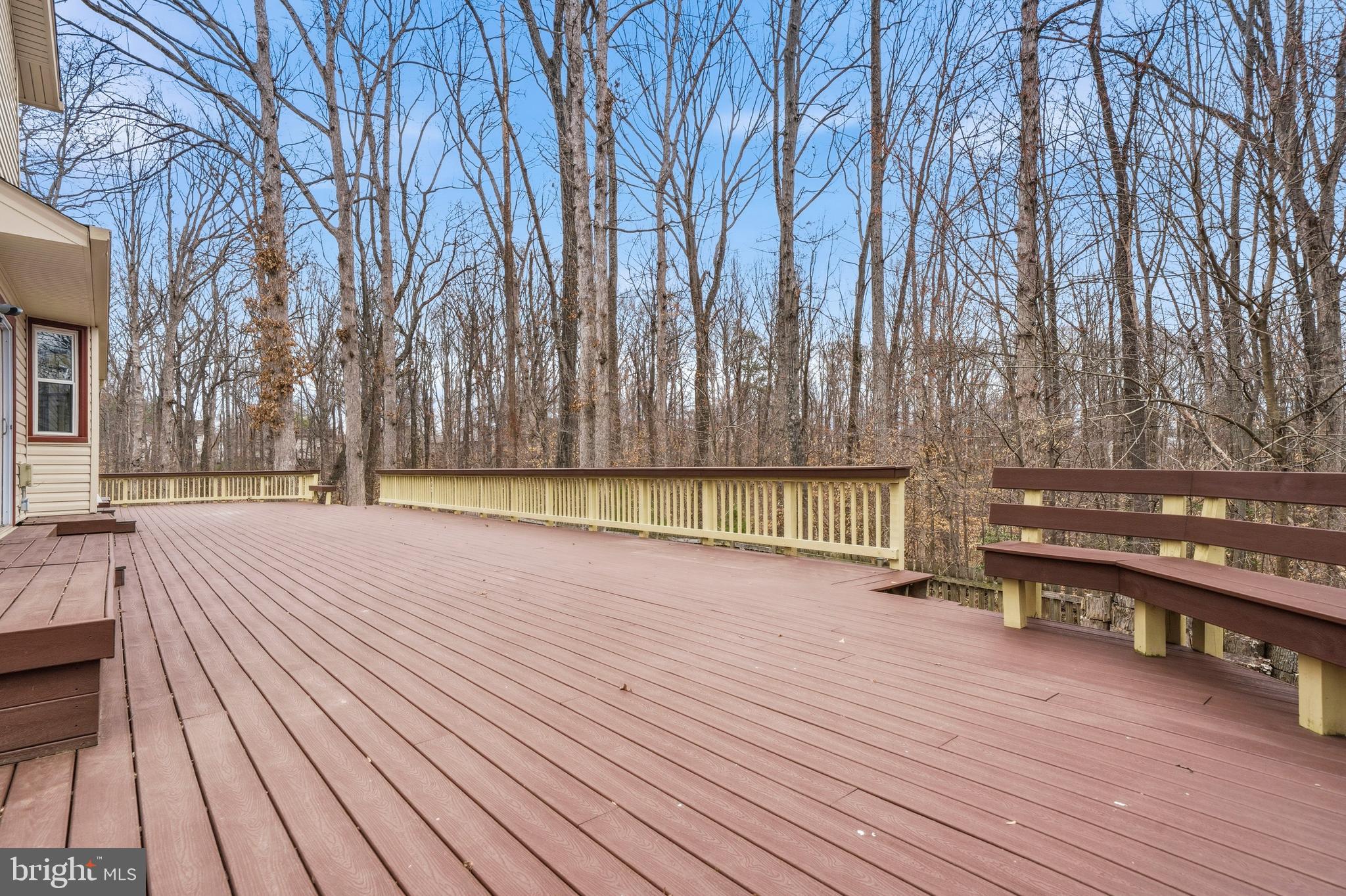 7201 Neaptide Lane Burke, VA 22015 - Photo 50 of 75 a view of wooden floor and trees in the backyard of a house