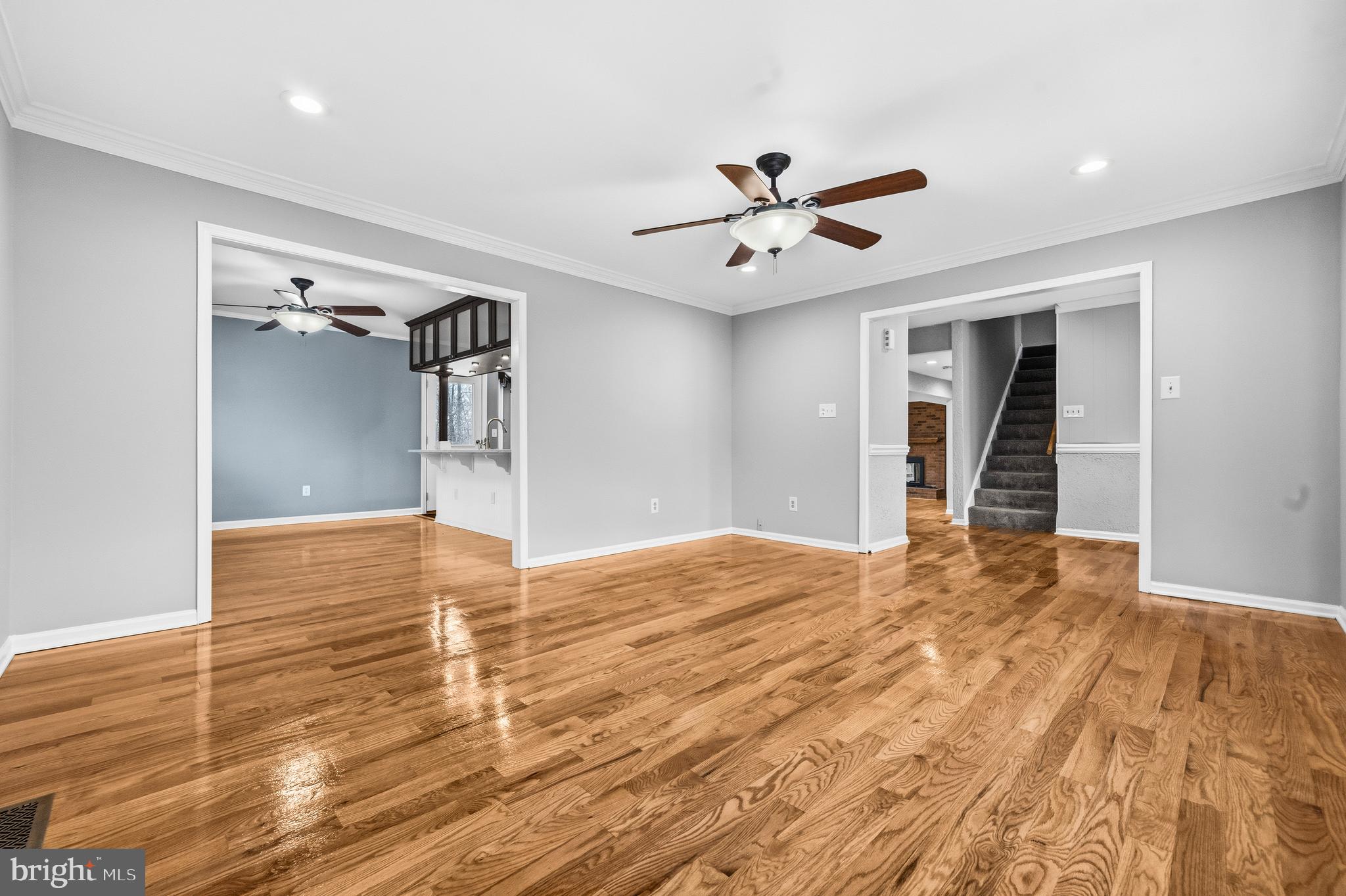 7201 Neaptide Lane Burke, VA 22015 - Photo 5 of 75 a view of empty room with wooden floor and fan