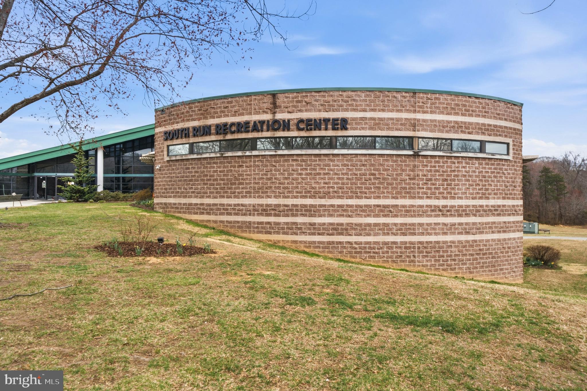 7201 Neaptide Lane Burke, VA 22015 - Photo 56 of 75 a view of a big building with swimming pool in front of it