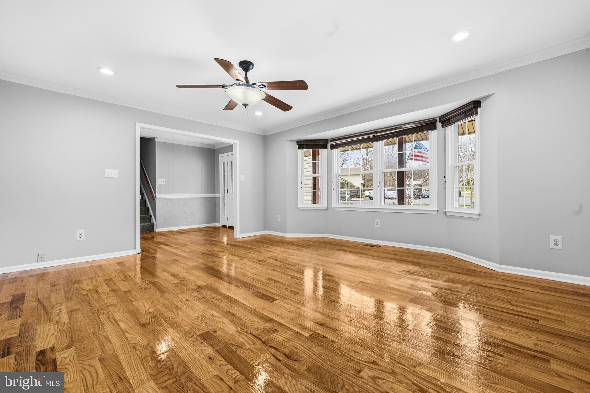 7201 Neaptide Lane Burke, VA 22015 - Photo 6 of 75 a view of empty room with wooden floor and fan