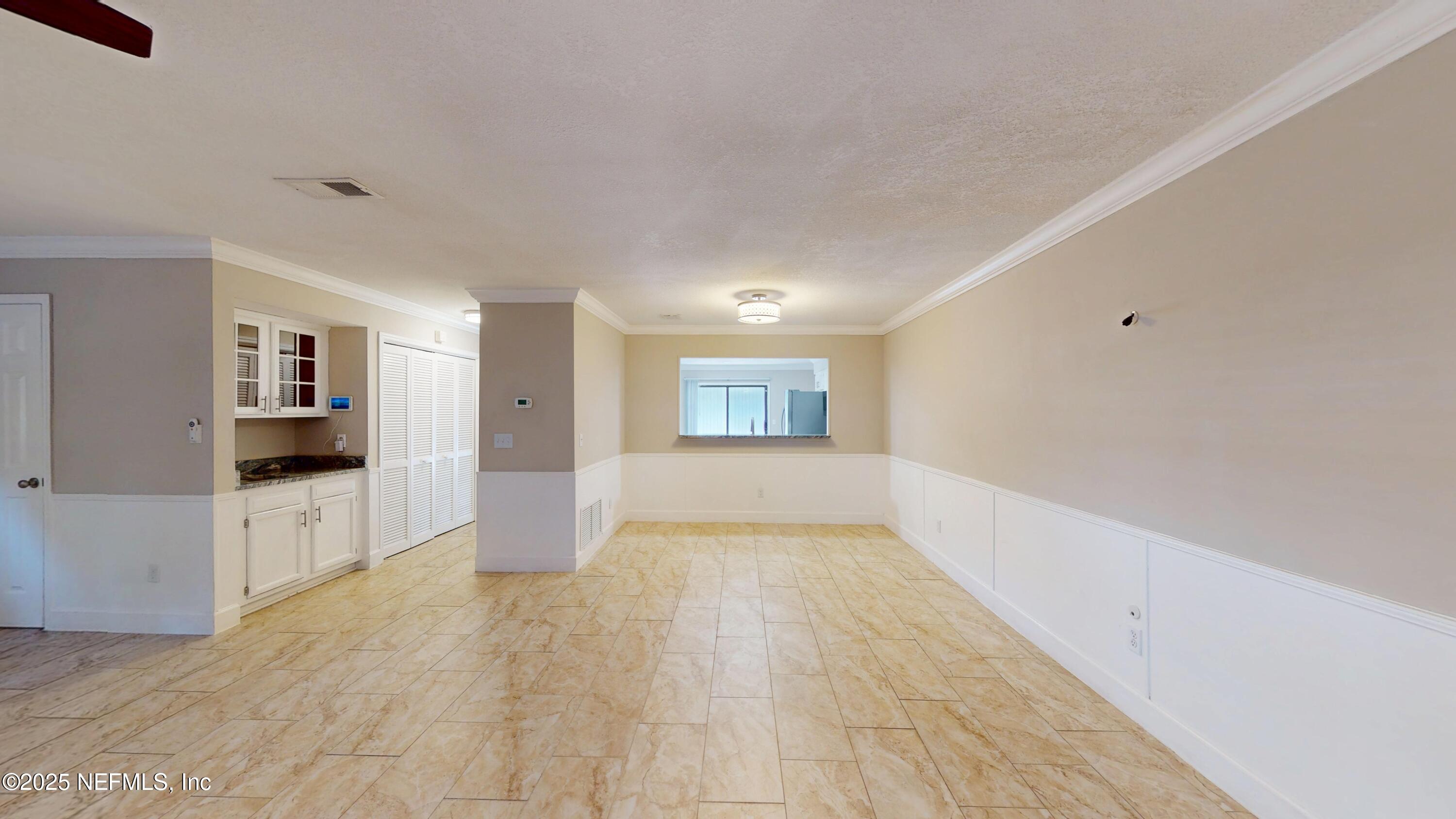 4402 Peppermill Place Jacksonville, FL 32257 - Photo 12 of 26 a view of empty room with wooden floor
