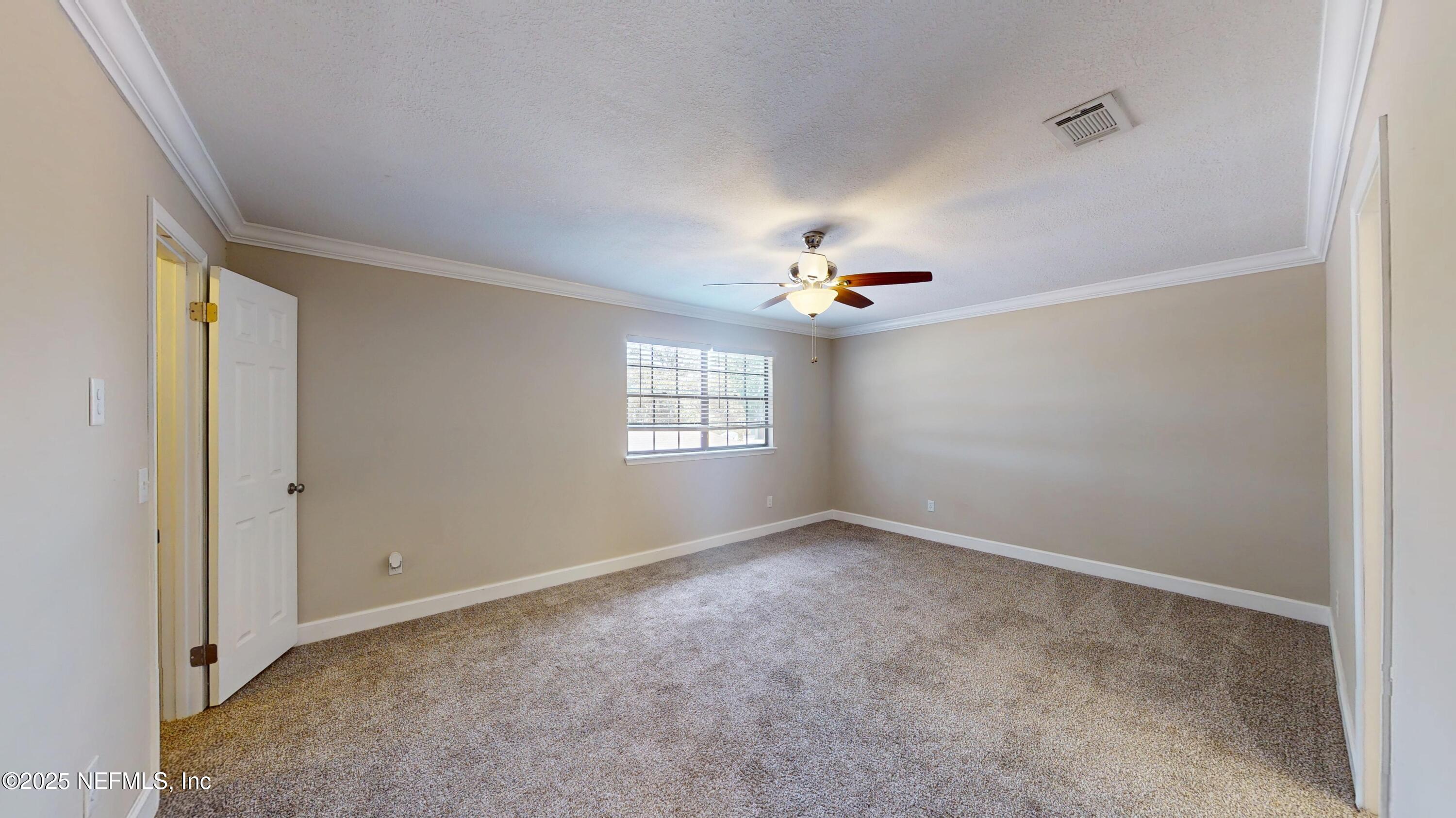 4402 Peppermill Place Jacksonville, FL 32257 - Photo 13 of 26 a view of an empty room with a window