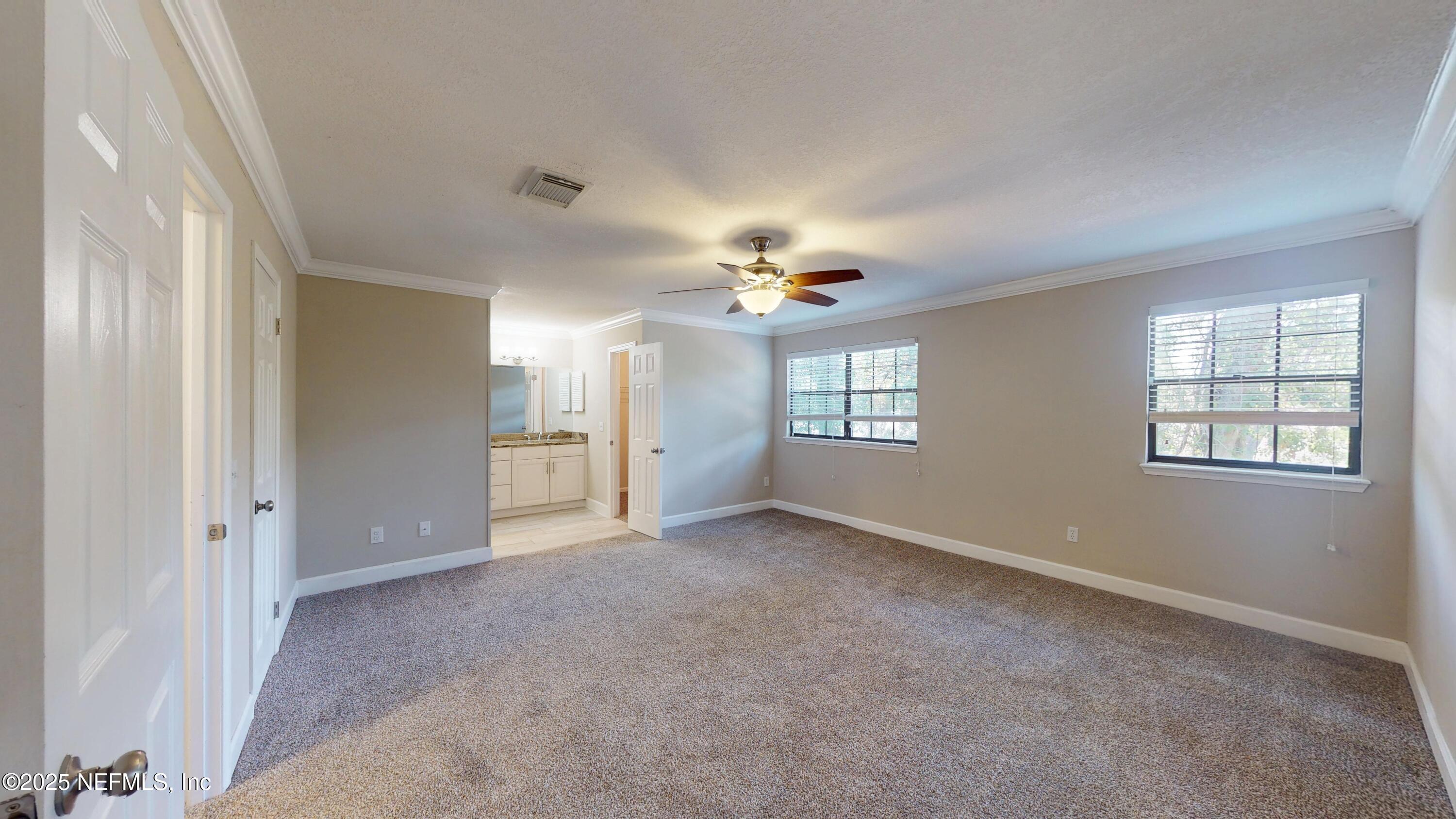 4402 Peppermill Place Jacksonville, FL 32257 - Photo 17 of 26 a view of an empty room with a window