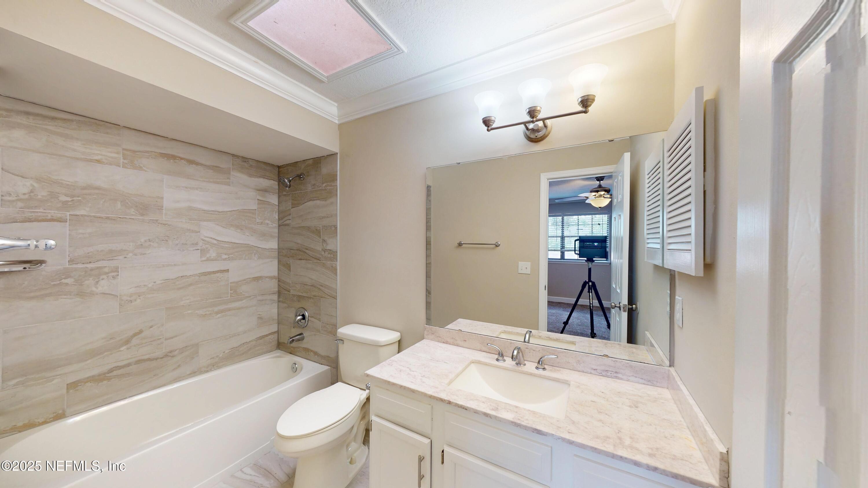 4402 Peppermill Place Jacksonville, FL 32257 - Photo 18 of 26 a bathroom with a sink a toilet a mirror and shower