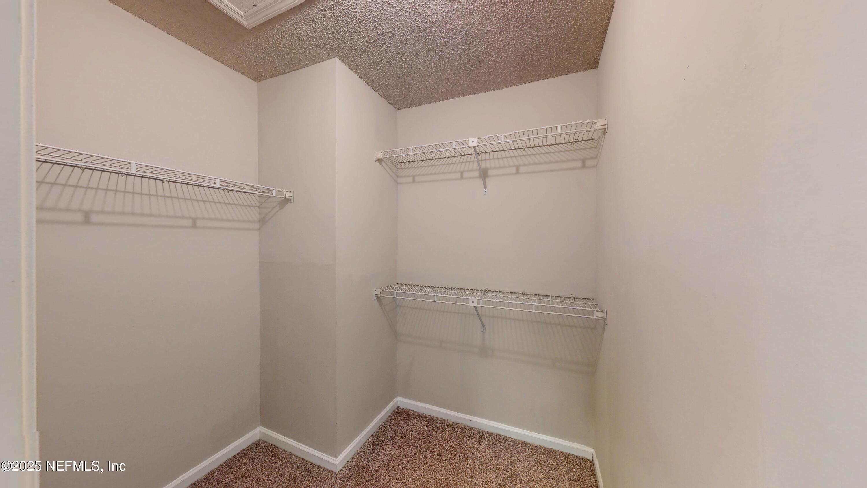 4402 Peppermill Place Jacksonville, FL 32257 - Photo 21 of 26 a view of an empty walk in closet