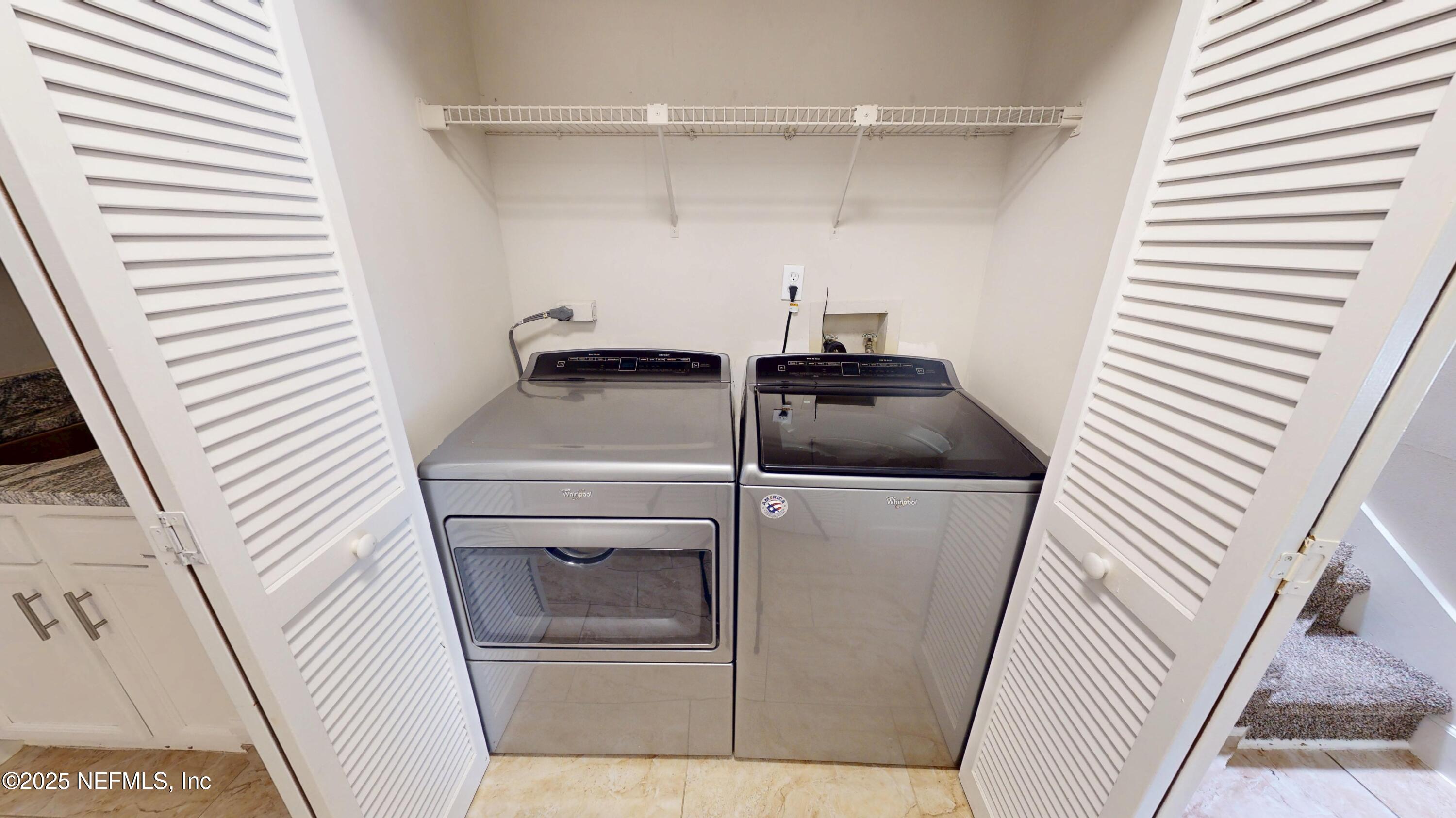 4402 Peppermill Place Jacksonville, FL 32257 - Photo 22 of 26 a utility room with dryer and washer