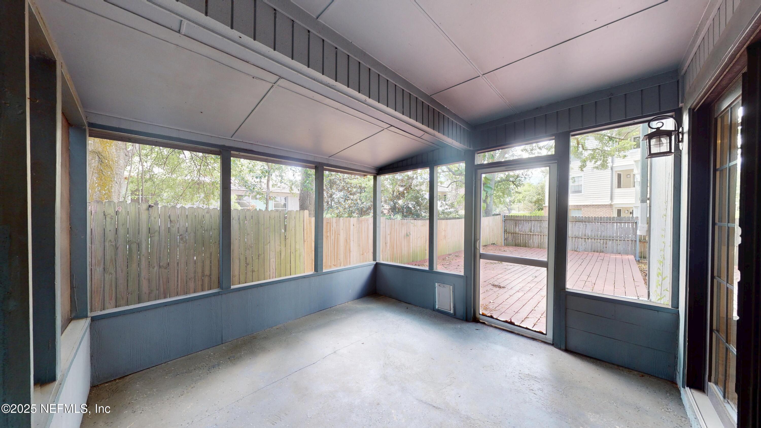 4402 Peppermill Place Jacksonville, FL 32257 - Photo 23 of 26 a view of an empty room with a large window
