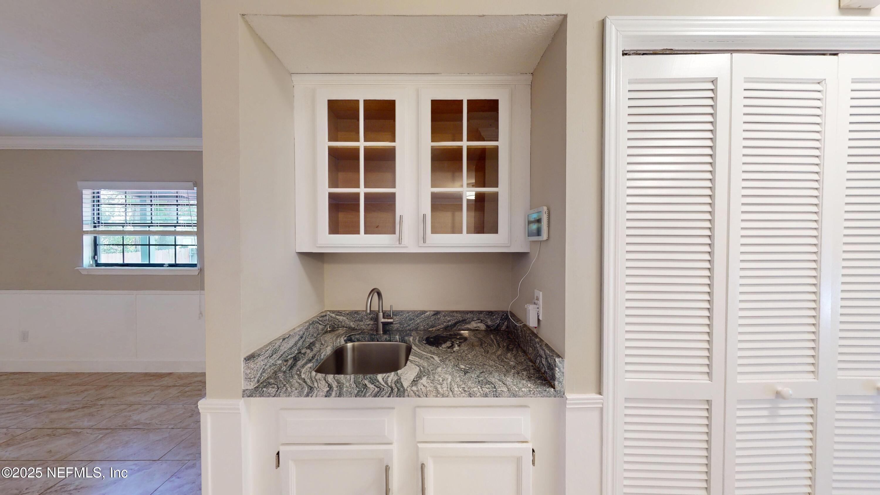 4402 Peppermill Place Jacksonville, FL 32257 - Photo 9 of 26 a kitchen with a sink and cabinets