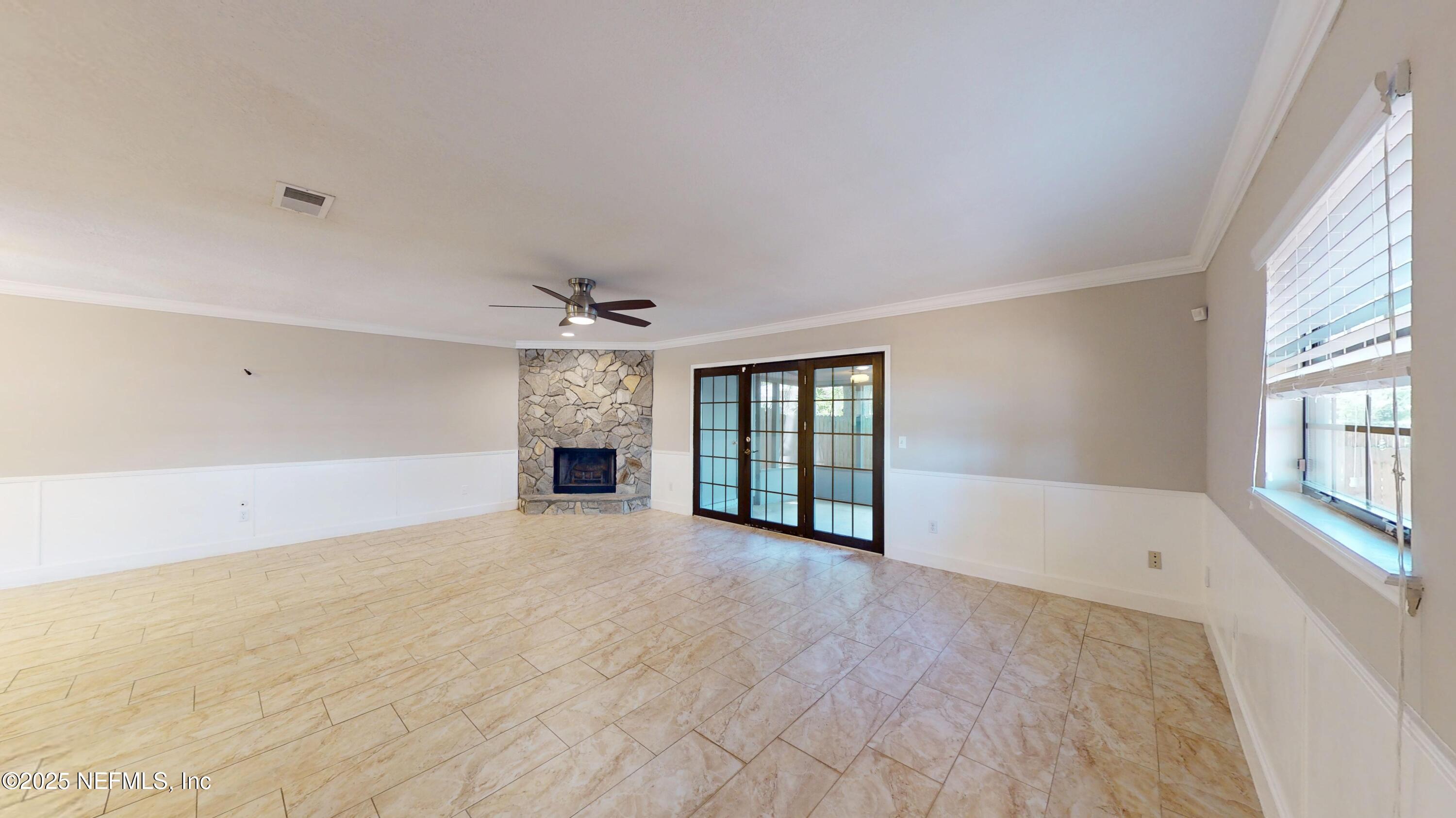 4402 Peppermill Place Jacksonville, FL 32257 - Photo 10 of 26 wooden floor in an empty room with a window