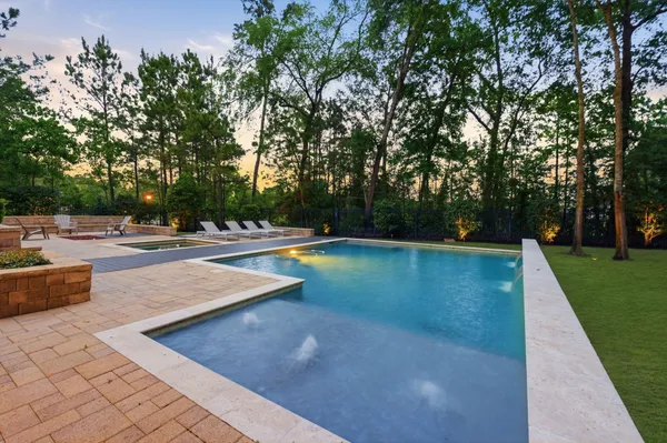 a view of a swimming pool with a yard