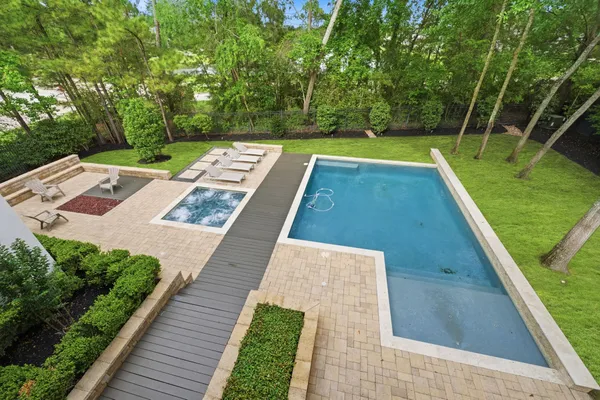 a backyard of a house with table and chairs