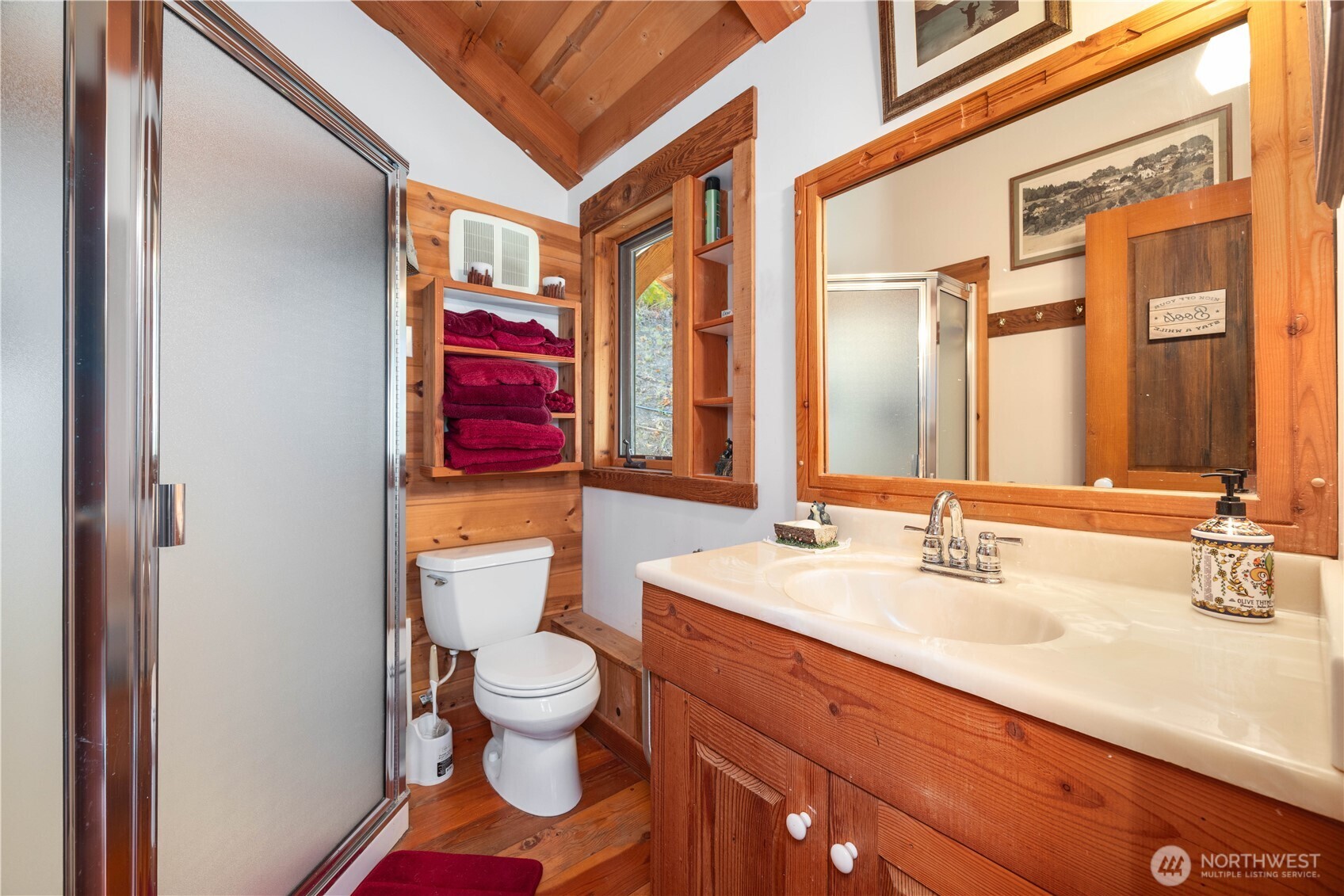 16495 South Lakeshore Road Chelan, WA 98816 - Photo 29 of 40 a bathroom with a sink a toilet and a large mirror