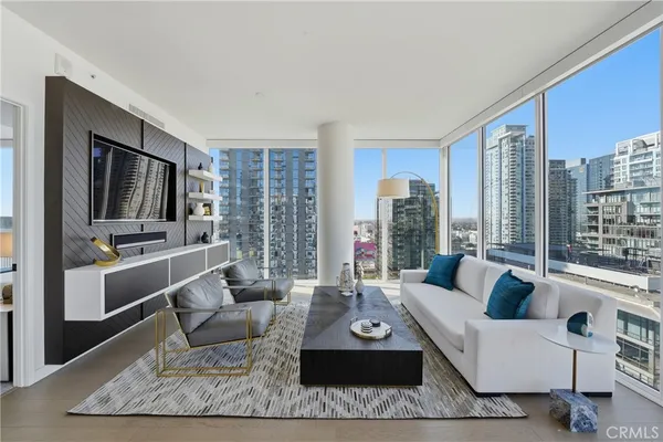 a living room with furniture and a flat screen tv