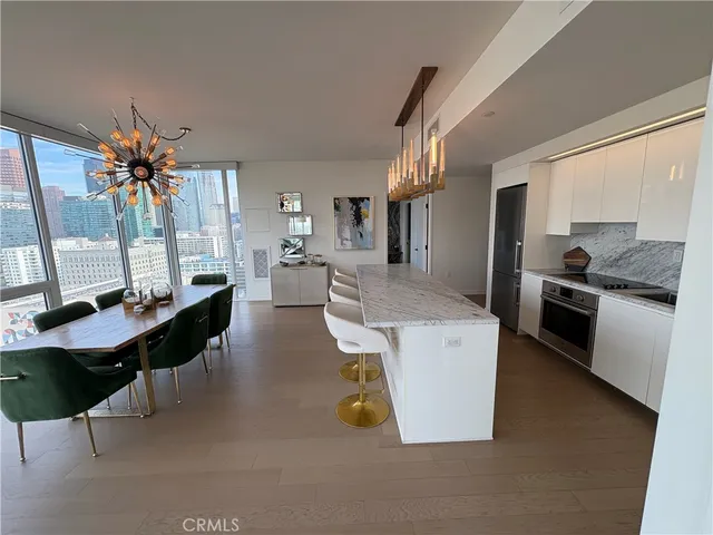 a living room with fireplace furniture and a table