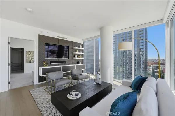 a living room with furniture and a flat screen tv