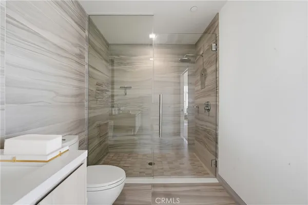 a bathroom with a shower and a toilet