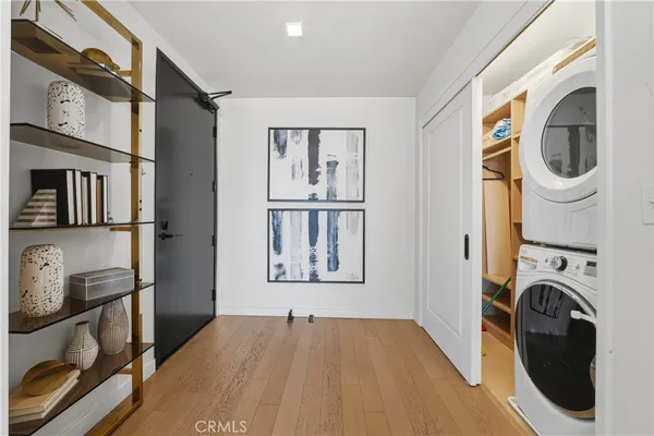 a view of a storage and utility room with washer and dryer
