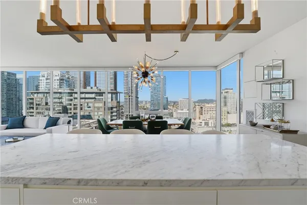 a view of a living room and kitchen