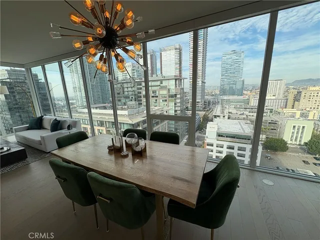 a view of a dining room with furniture and window