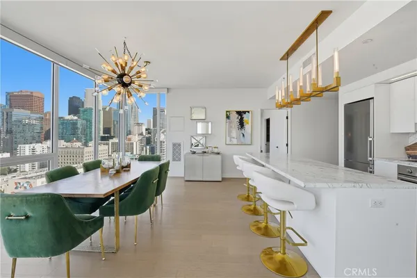 a very nice looking dining room with a large window