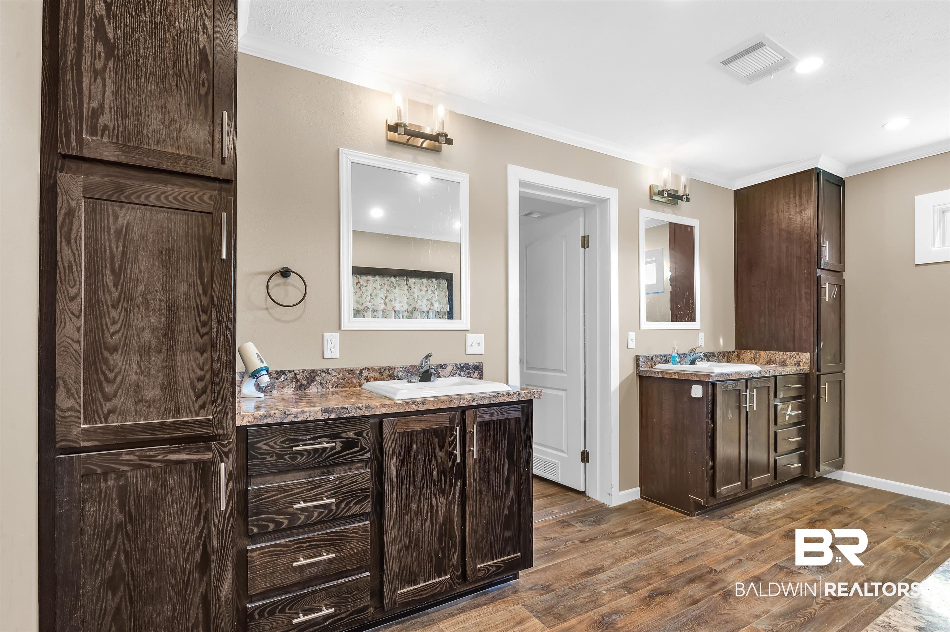 23233 Forland Road Silverhill, AL 36576 - Photo 23 of 33 Full bath with visible vents, wood finished floors, and a sink