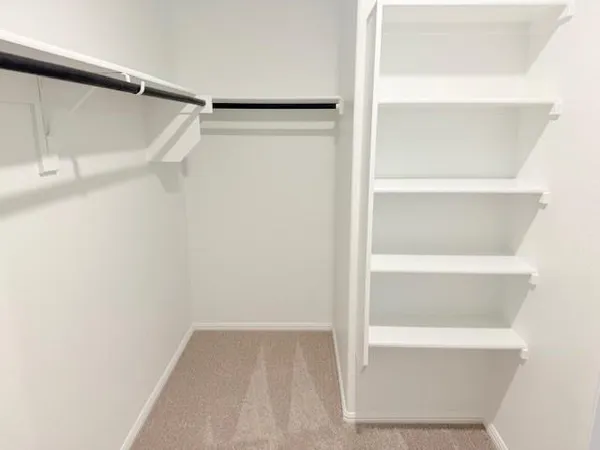 a view of an empty walk in closet