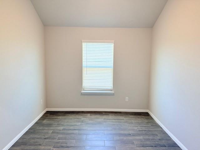 14205 Bacton Road Pilot Point, TX 76258 - Photo 7 of 19 a view of an empty room with wooden floor and a window