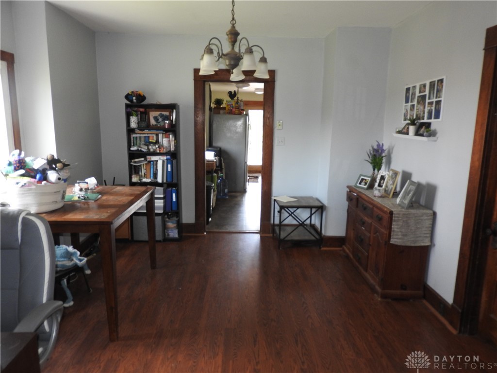 2105 East Loy Road Piqua, OH 45356 - Photo 14 of 26 This versatile space features rich hardwood flooring and classic lighting, perfect for everyday living.
