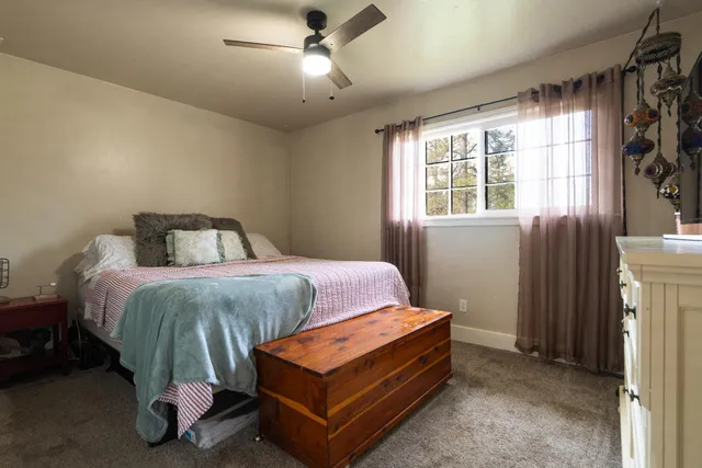 a bedroom with a bed and window