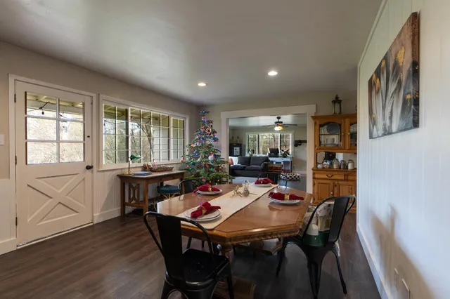 a view of a dining room with furniture window and wooden floor