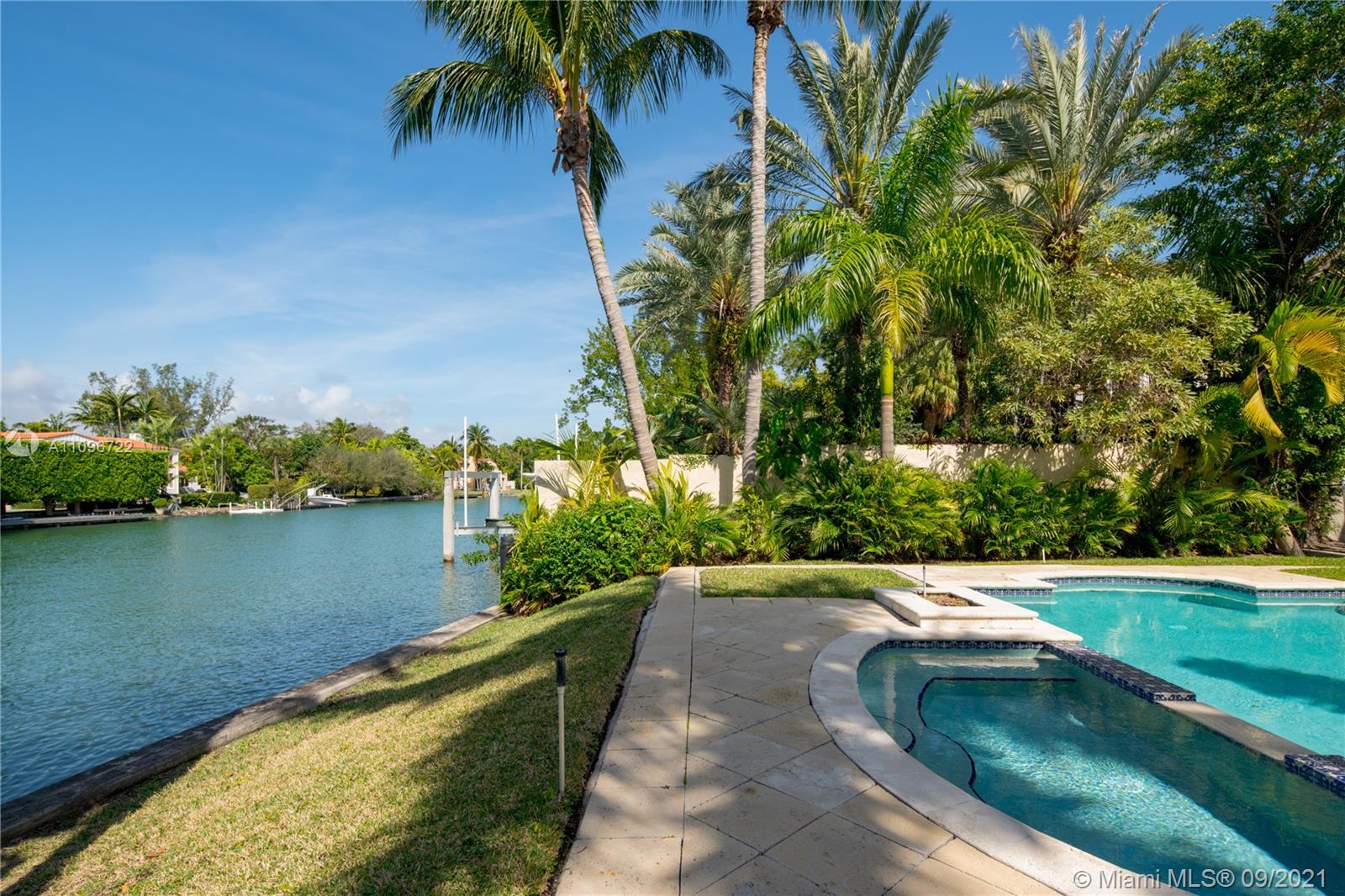 4900 Pine Tree Drive Miami Beach, FL 33140 - Photo 11 of 64 a view of swimming pool with a garden