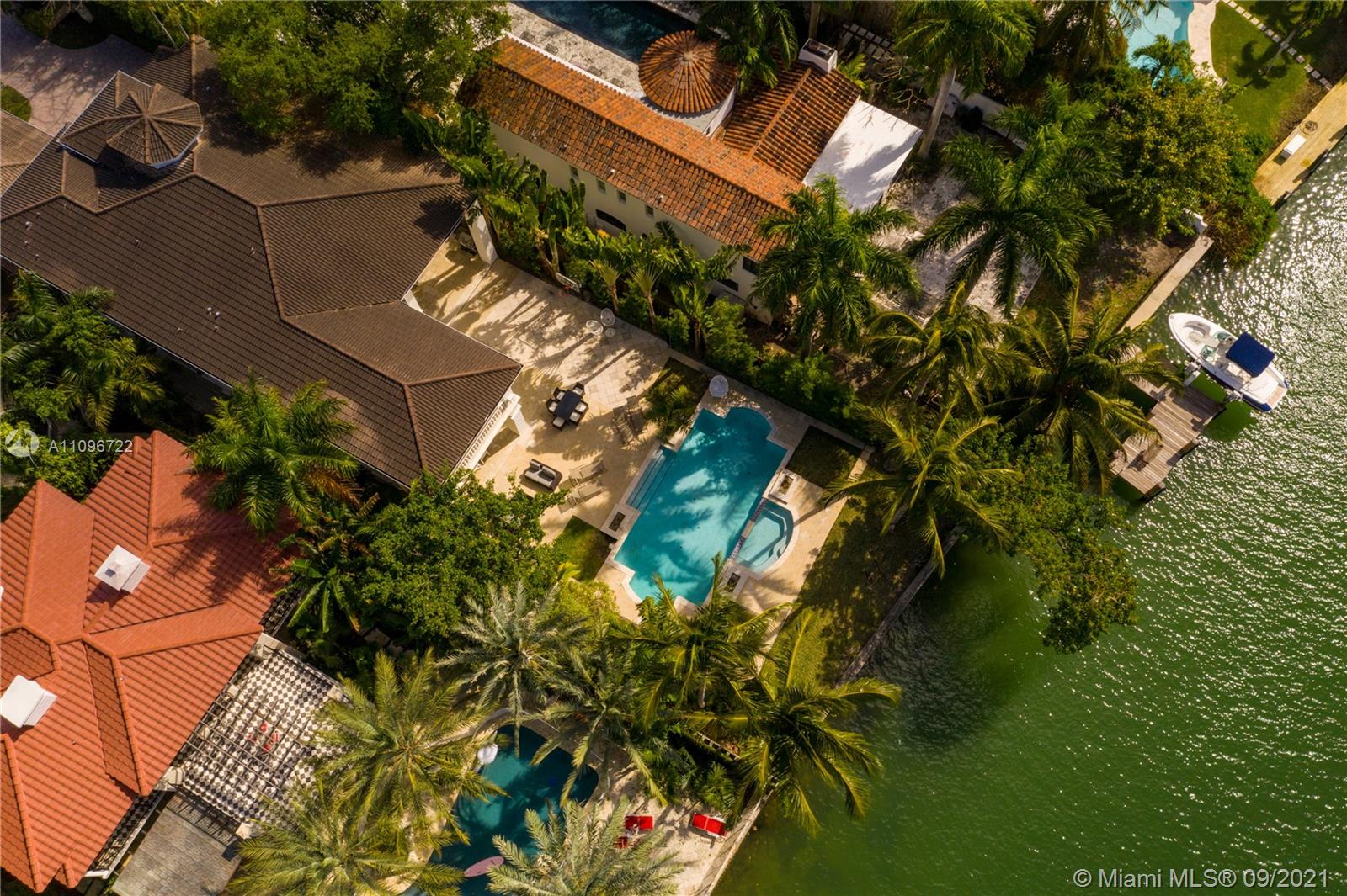 4900 Pine Tree Drive Miami Beach, FL 33140 - Photo 4 of 64 an aerial view of a house with a yard