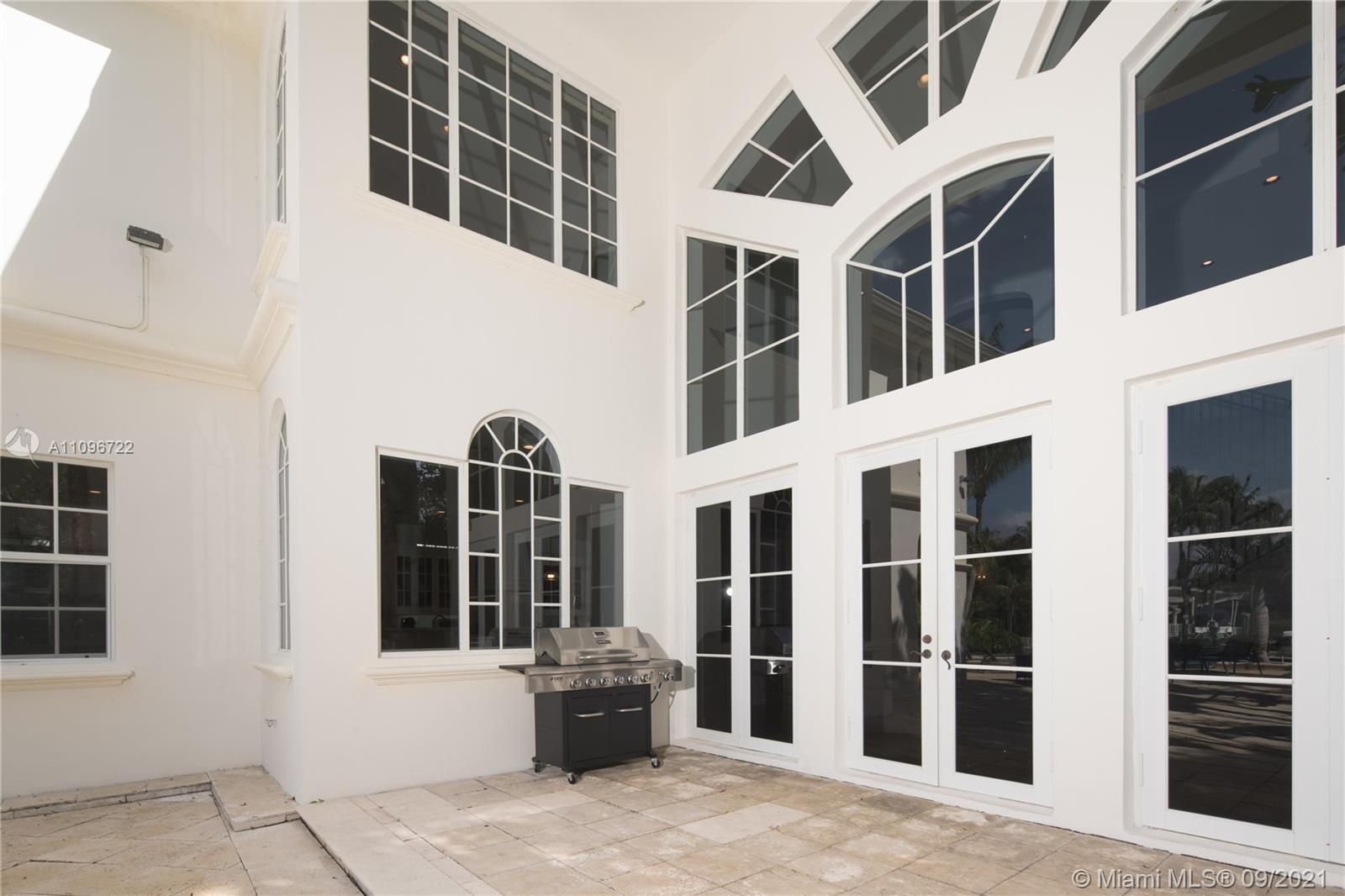 4900 Pine Tree Drive Miami Beach, FL 33140 - Photo 34 of 64 a front view of a building with a outdoor space