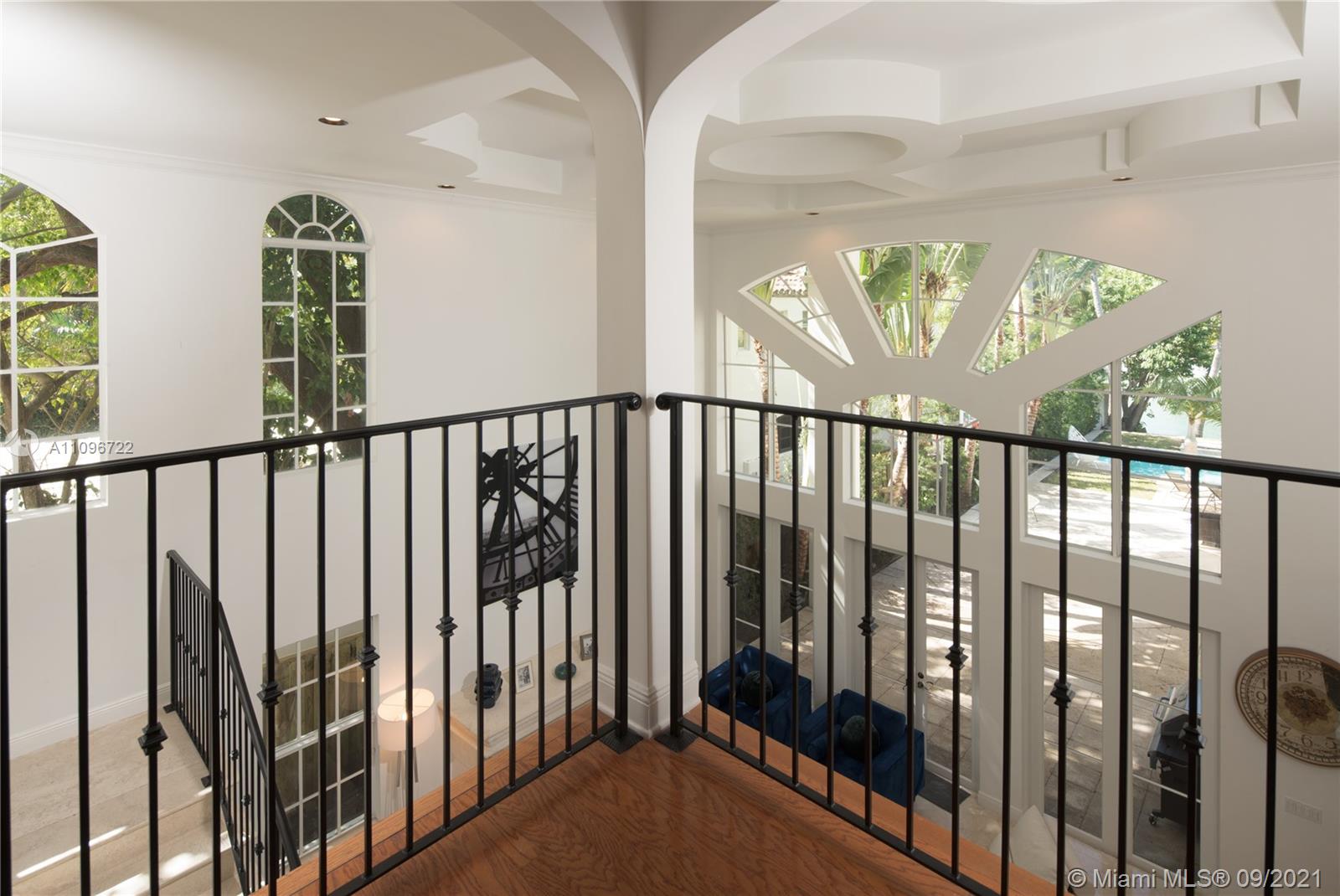 4900 Pine Tree Drive Miami Beach, FL 33140 - Photo 38 of 64 a view of staircase with rug floor