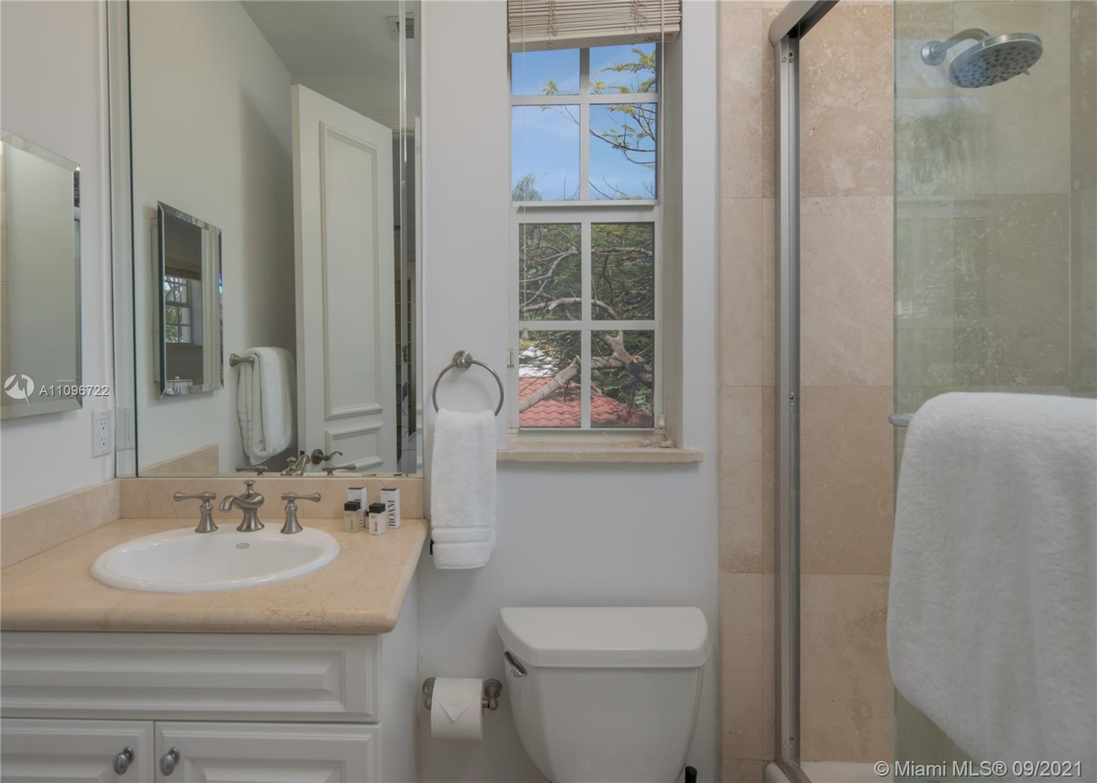 4900 Pine Tree Drive Miami Beach, FL 33140 - Photo 48 of 64 a bathroom with a sink toilet and shower