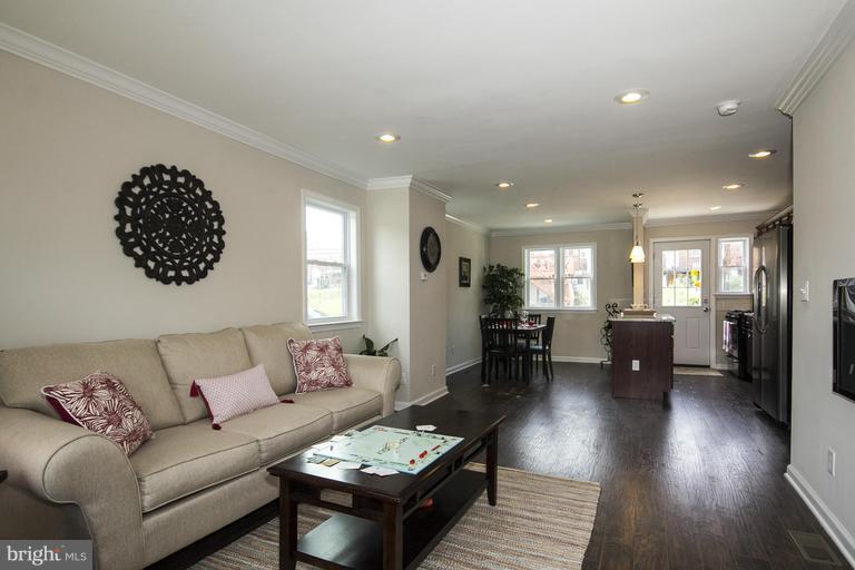 5407 Masefield Road Baltimore, MD 21229 - Photo 1 of 1 a living room with furniture and wooden floor