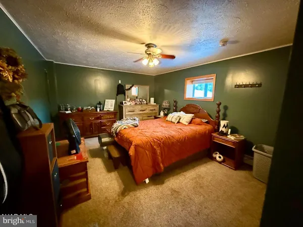 a bed room with a bed and a lamp