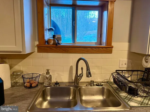 a bathroom with a sink and a window