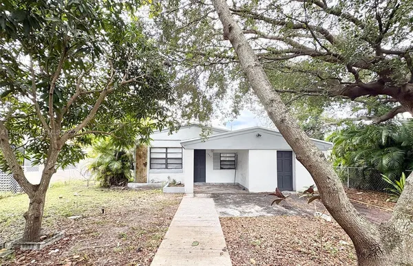 front view of a house with a trees